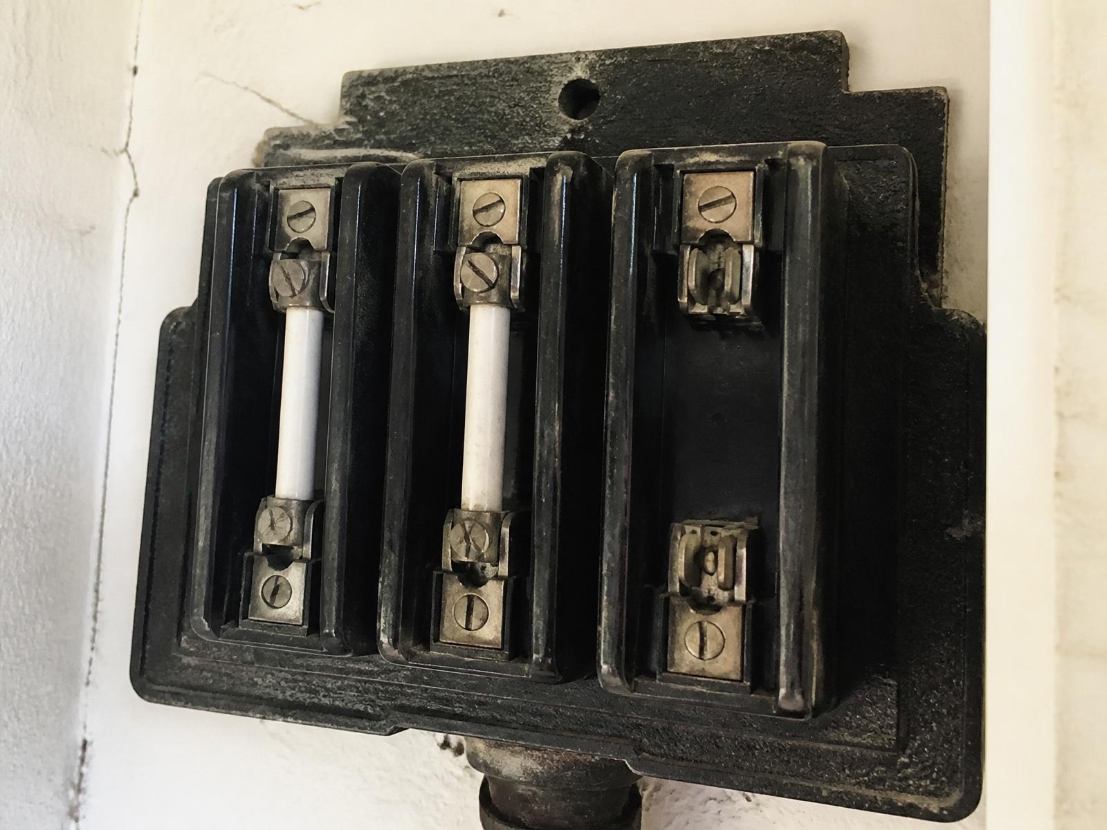 Old ceramic fuse board before switchboard upgrade